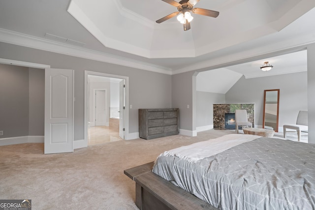 100 Braxton Way, Roswell, GA 30075 - bedroom featuring light colored carpet, a raised ceiling, a glass covered fireplace, ornamental molding, and baseboards