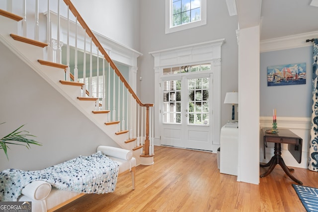 100 Braxton Way, Roswell, GA 30075 - entryway featuring wood finished floors, stairs, crown molding, and a high ceiling
