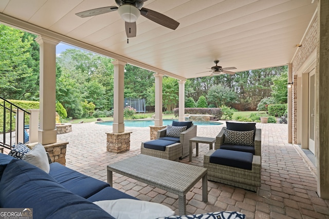 100 Braxton Way, Roswell, GA 30075 - view of patio featuring ceiling fan, an outdoor living space, view of scattered trees, and a pool with connected hot tub