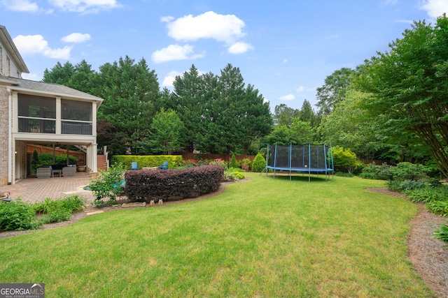 100 Braxton Way, Roswell, GA 30075 - view of yard with a trampoline, a patio, and a sunroom