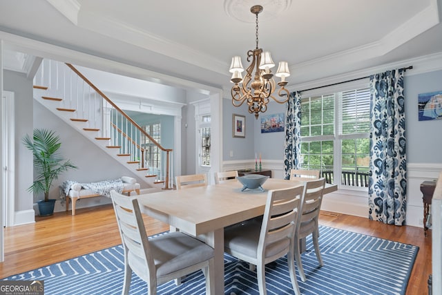 100 Braxton Way, Roswell, GA 30075 - dining room featuring stairway, wood finished floors, ornamental molding, a chandelier, and wainscoting