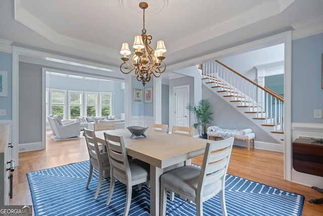 100 Braxton Way, Roswell, GA 30075 - dining room with stairway, a chandelier, wood finished floors, and ornamental molding