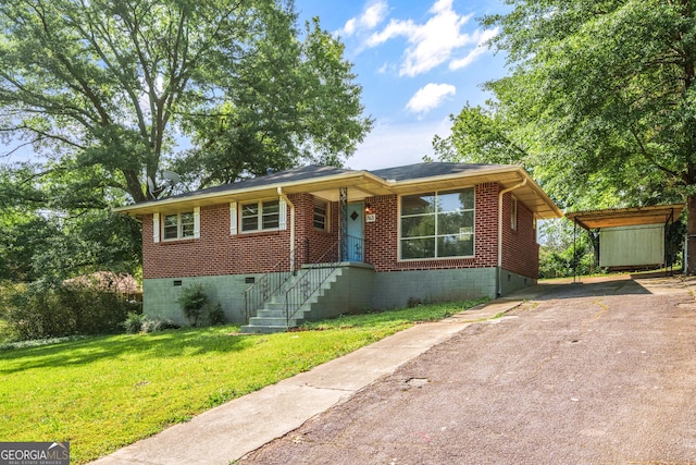 765 Shellnut Dr, Forest Park, GA 30297 - view of front facade with driveway, a front yard, and brick siding