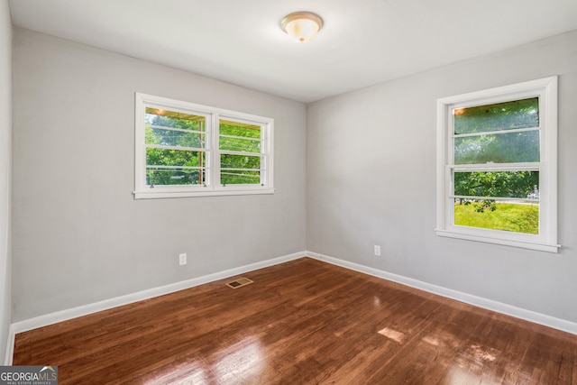 765 Shellnut Dr, Forest Park, GA 30297 - empty room featuring baseboards and dark wood-type flooring