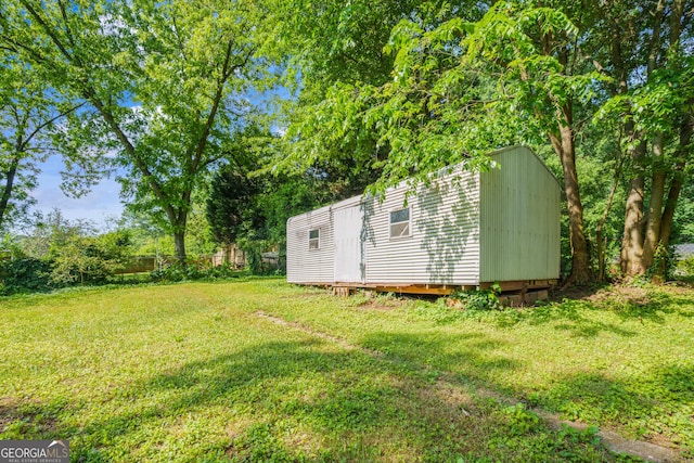 765 Shellnut Dr, Forest Park, GA 30297 - view of grassy yard with an outdoor structure and a shed