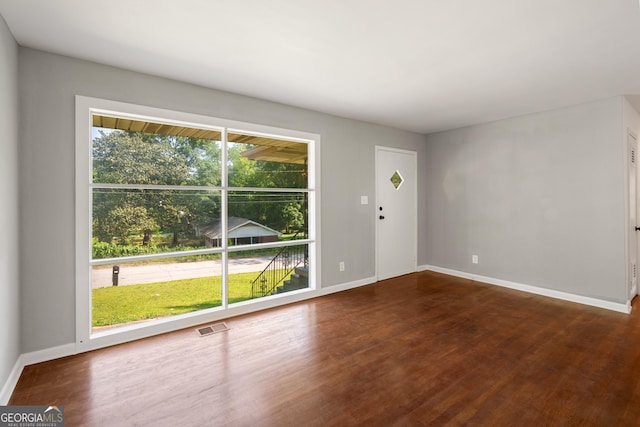 765 Shellnut Dr, Forest Park, GA 30297 - unfurnished living room with wood finished floors and baseboards