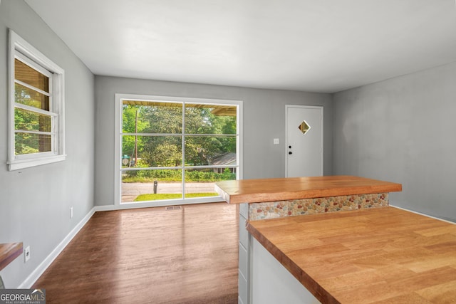 765 Shellnut Dr, Forest Park, GA 30297 - unfurnished dining area featuring wood finished floors and baseboards