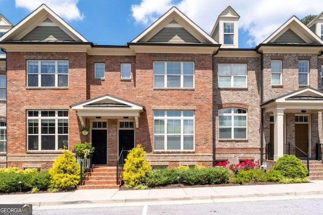 view of front of home with brick siding