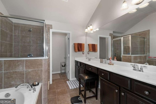 full bathroom featuring lofted ceiling, a shower stall, double vanity, tile patterned floors, and a bath