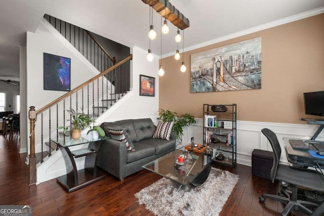 living room with ornamental molding, a desk, hardwood / wood-style flooring, stairs, and wainscoting