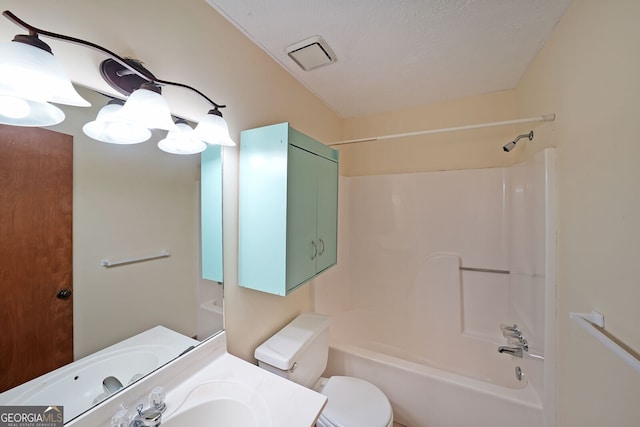 bathroom featuring toilet, washtub / shower combination, and vanity