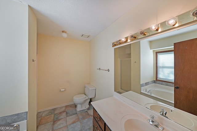 full bathroom featuring a stall shower, vanity, a garden tub, and toilet