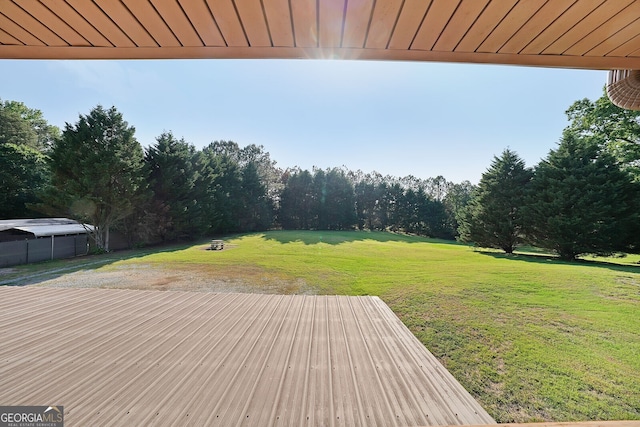 wooden terrace with a yard
