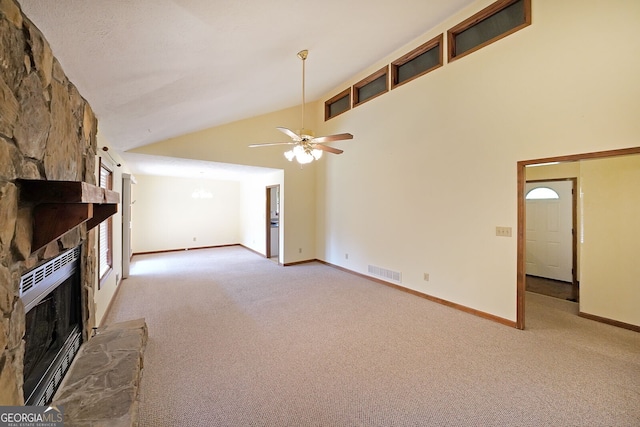 unfurnished living room with a fireplace, light carpet, a ceiling fan, high vaulted ceiling, and baseboards