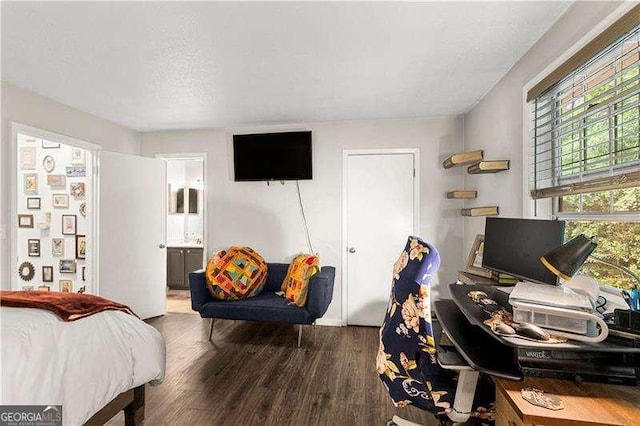 6900 Roswell Rd Unit 3N, Atlanta, GA 30328 - bedroom featuring wood finished floors, ensuite bathroom, and a textured ceiling
