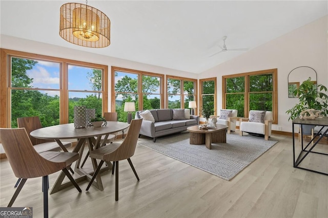 196 Mcelroy Mountain Dr, Jasper, GA 30143 - living area featuring plenty of natural light, light wood-type flooring, lofted ceiling, ceiling fan, and a chandelier