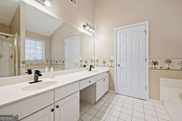 full bathroom featuring tile patterned flooring, a bath, a stall shower, double vanity, and lofted ceiling
