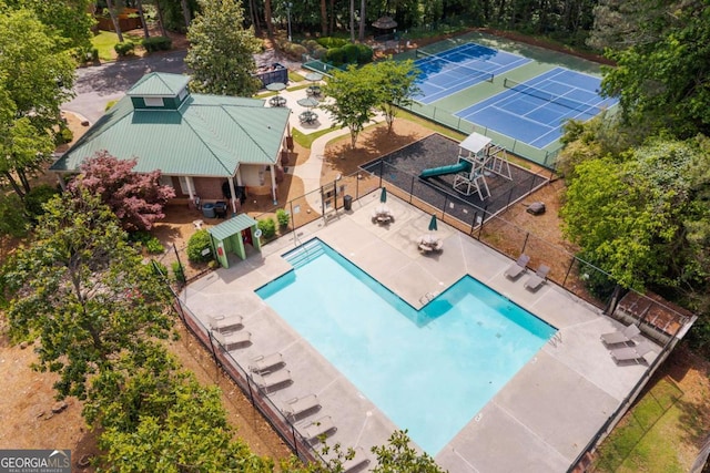 view of subject property featuring a pool area