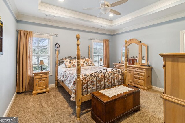 4 Honeysuckle Dr, Claxton, GA 30417 - bedroom with light carpet, crown molding, a tray ceiling, ceiling fan, and baseboards