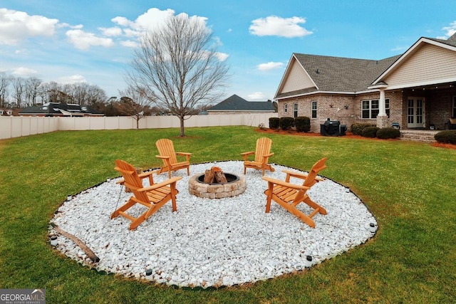 4 Honeysuckle Dr, Claxton, GA 30417 - view of yard featuring a fire pit and french doors