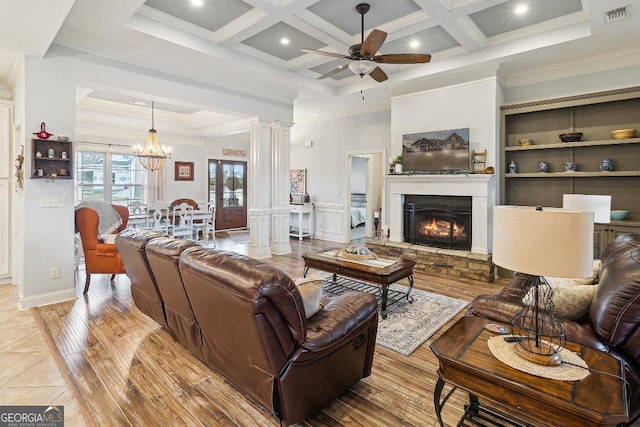 4 Honeysuckle Dr, Claxton, GA 30417 - living room featuring a ceiling fan, ornamental molding, coffered ceiling, a glass covered fireplace, and light wood-type flooring