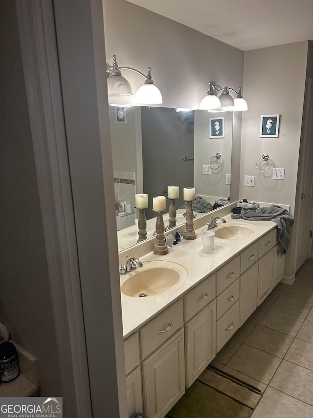 full bathroom with tile patterned floors and double vanity