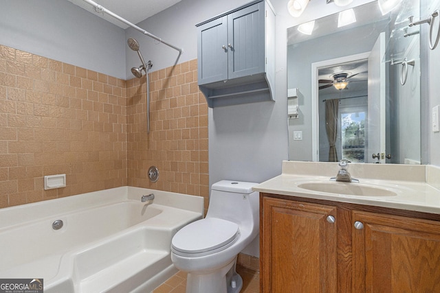 bathroom featuring toilet, washtub / shower combination, vanity, and ceiling fan