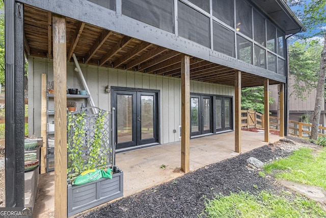 entrance to property featuring french doors and a patio
