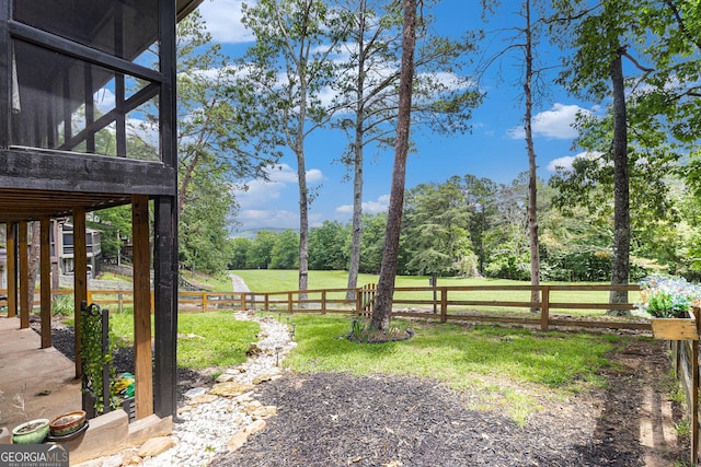 view of yard featuring a sunroom
