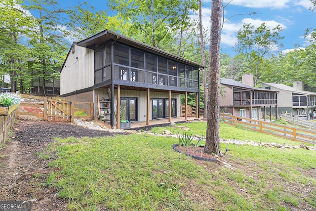rear view of house with a sunroom