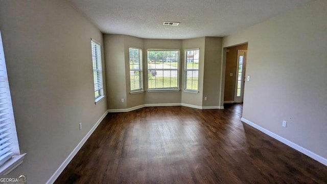 6231 Waterton Way, Lithonia, GA 30058 - empty room with dark wood finished floors and a textured ceiling