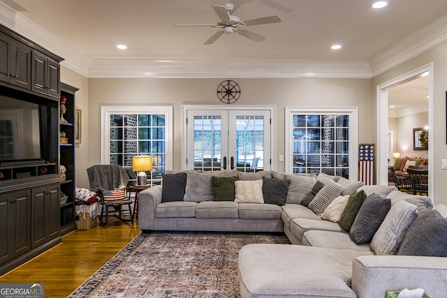 living area featuring dark wood-style floors, ceiling fan, ornamental molding, recessed lighting, and french doors