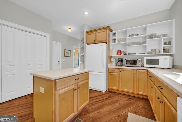 kitchen with white appliances, open shelves, wood finished floors, light brown cabinetry, and recessed lighting