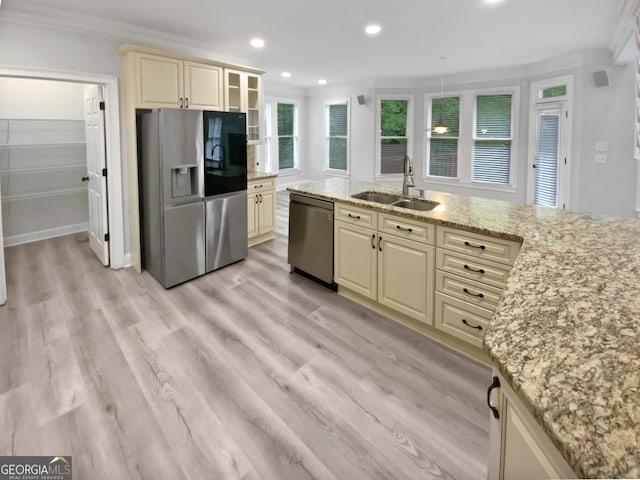 4345 Park Brooke Trce, Johns Creek, GA 30022 - kitchen featuring stainless steel appliances, cream cabinetry, ornamental molding, light stone counters, and light wood-style floors
