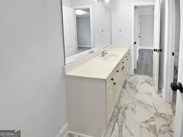 4345 Park Brooke Trce, Johns Creek, GA 30022 - bathroom featuring marble look tile flooring and vanity