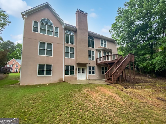 4345 Park Brooke Trce, Johns Creek, GA 30022 - rear view of house with a chimney, a patio area, stucco siding, and stairs