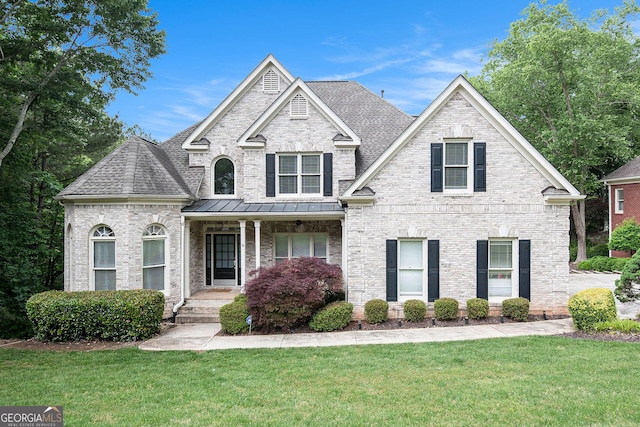 1640 Settindown Dr, Roswell, GA 30075 - view of front facade with a front lawn, a porch, a shingled roof, and brick siding