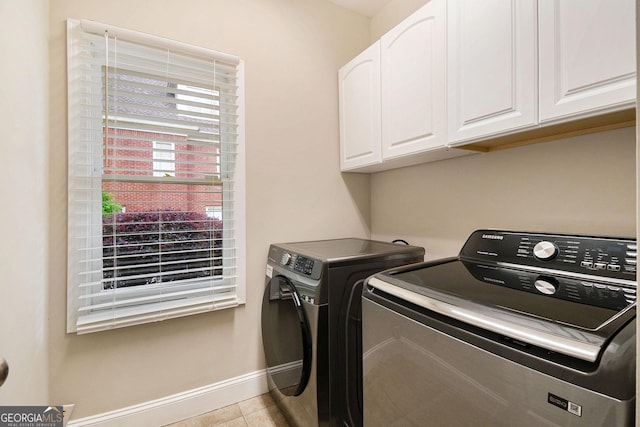 1640 Settindown Dr, Roswell, GA 30075 - laundry room with cabinet space, washing machine and clothes dryer, baseboards, and tile patterned floors