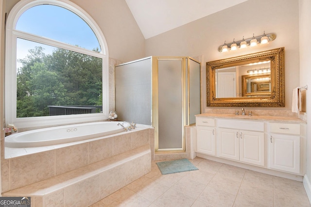1640 Settindown Dr, Roswell, GA 30075 - full bath featuring vanity, a garden tub, a shower stall, vaulted ceiling, and tile patterned flooring