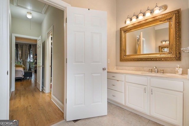 1640 Settindown Dr, Roswell, GA 30075 - bathroom with vanity, wood finished floors, and baseboards