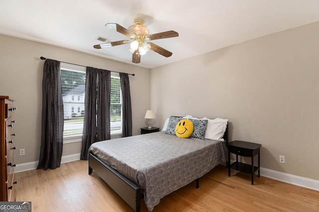 1640 Settindown Dr, Roswell, GA 30075 - bedroom featuring light wood-type flooring, baseboards, and ceiling fan