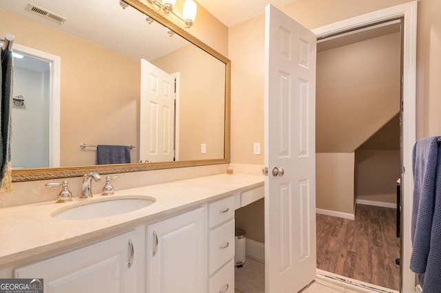 1640 Settindown Dr, Roswell, GA 30075 - bathroom featuring vanity and wood finished floors