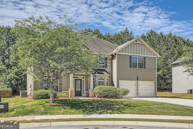 349 Pennant Ln, Fairburn, GA 30213 - craftsman-style home featuring board and batten siding, driveway, an attached garage, a front yard, and cooling unit