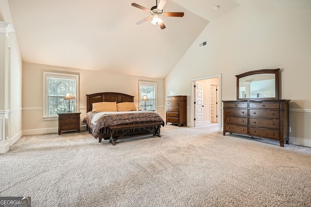 349 Pennant Ln, Fairburn, GA 30213 - carpeted bedroom with high vaulted ceiling, multiple windows, baseboards, and a ceiling fan