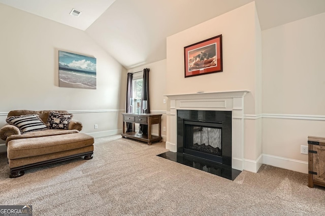 349 Pennant Ln, Fairburn, GA 30213 - living room with carpet, vaulted ceiling, a fireplace with flush hearth, and baseboards