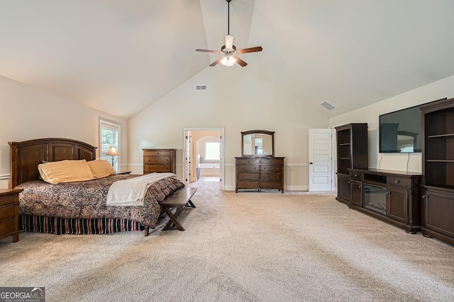 349 Pennant Ln, Fairburn, GA 30213 - bedroom featuring high vaulted ceiling, light carpet, ensuite bath, and a ceiling fan