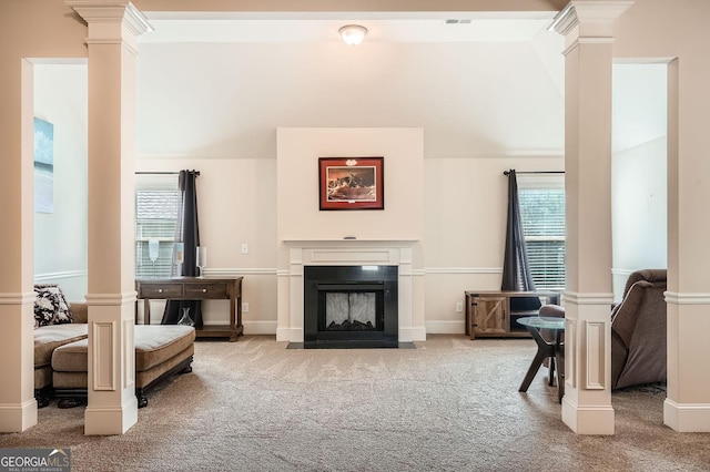349 Pennant Ln, Fairburn, GA 30213 - living room featuring decorative columns, carpet, and vaulted ceiling