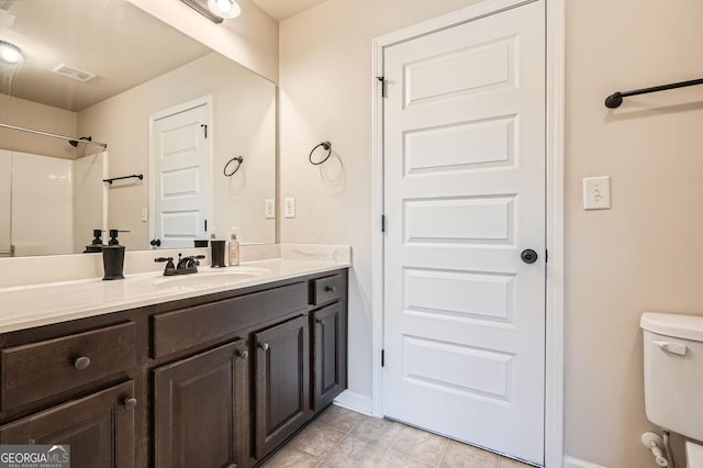 349 Pennant Ln, Fairburn, GA 30213 - bathroom featuring vanity, toilet, baseboards, and tile patterned floors
