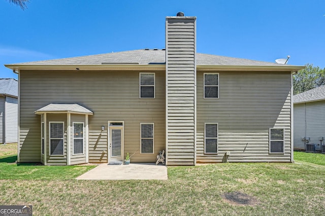 349 Pennant Ln, Fairburn, GA 30213 - back of house featuring a patio area, cooling unit, and a lawn
