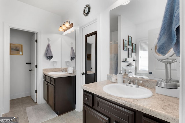 full bathroom featuring two vanities